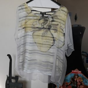 Striped top with yellow flower